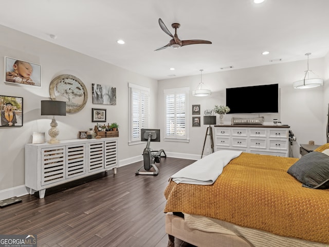 bedroom featuring ceiling fan and dark wood-type flooring