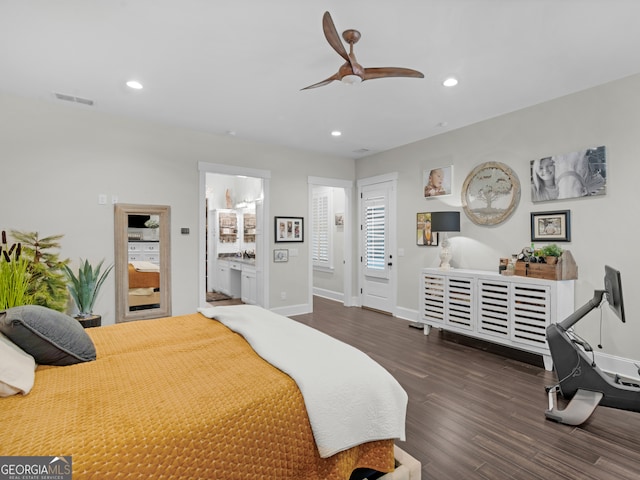 bedroom featuring ceiling fan, dark wood-type flooring, and connected bathroom