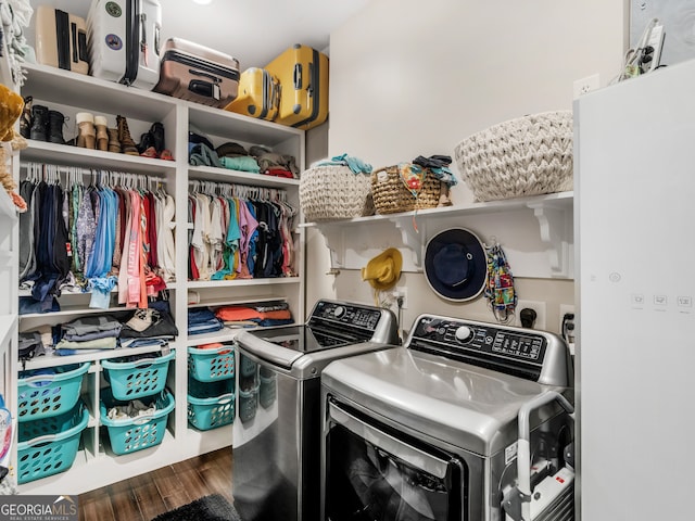 laundry area featuring independent washer and dryer and hardwood / wood-style flooring