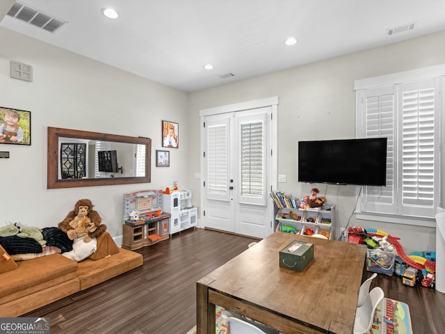 game room featuring dark hardwood / wood-style flooring and french doors