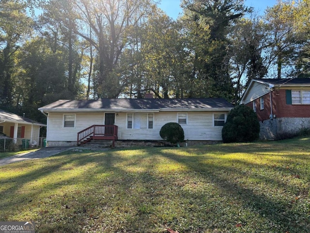 single story home featuring a front yard