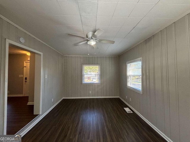 empty room featuring dark hardwood / wood-style flooring