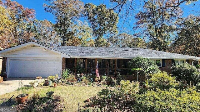 ranch-style home featuring a garage