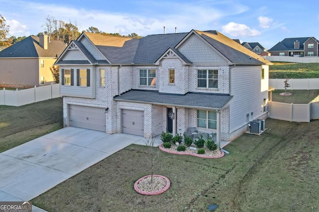 craftsman-style home with concrete driveway, central air condition unit, fence, brick siding, and a garage