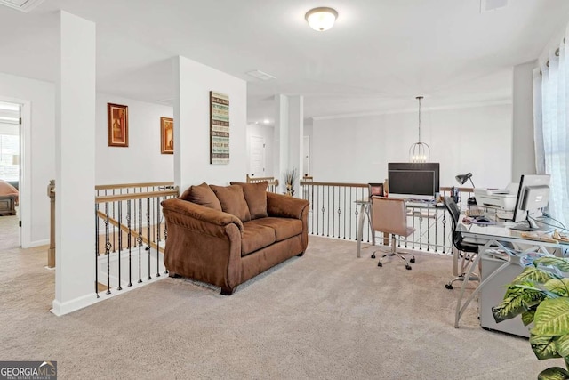 carpeted living area featuring baseboards