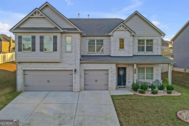 craftsman-style house featuring an attached garage, concrete driveway, a front yard, brick siding, and roof with shingles