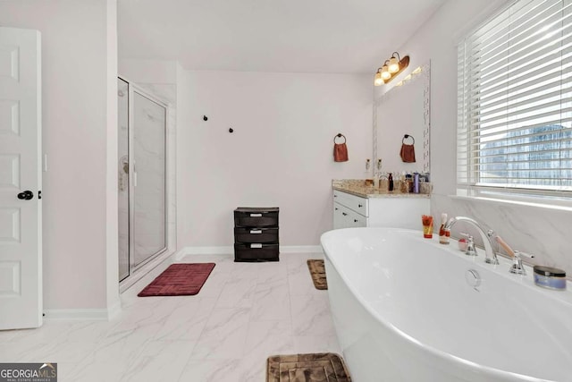 full bath featuring vanity, baseboards, a shower stall, marble finish floor, and a freestanding bath
