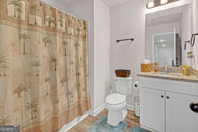 full bathroom with baseboards, toilet, wood finished floors, vanity, and a shower with curtain