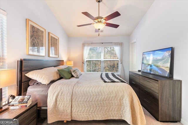 bedroom featuring ceiling fan, light carpet, and lofted ceiling