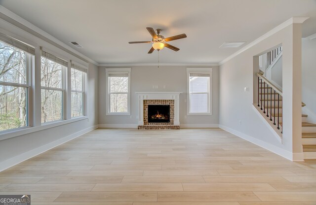 hall with a wealth of natural light and light colored carpet