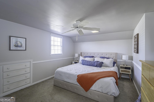 bedroom featuring vaulted ceiling, ceiling fan, and dark colored carpet