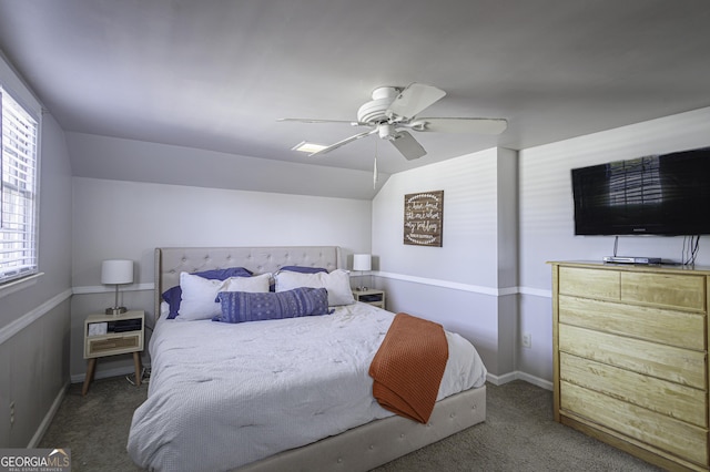 carpeted bedroom featuring lofted ceiling and ceiling fan