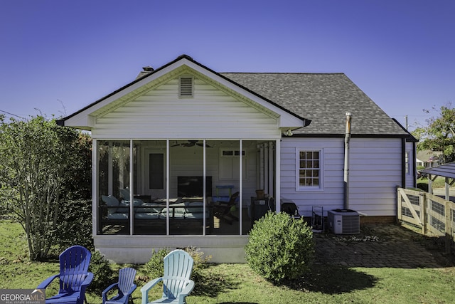 back of house with a sunroom and central AC unit