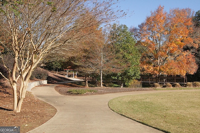 surrounding community featuring a lawn