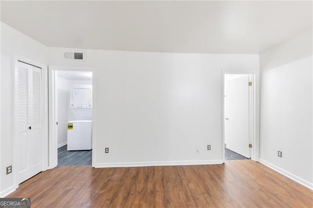 unfurnished room featuring hardwood / wood-style flooring