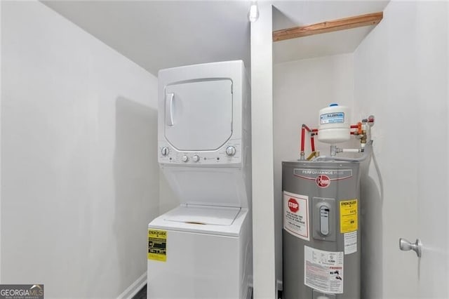 laundry area with stacked washing maching and dryer and water heater