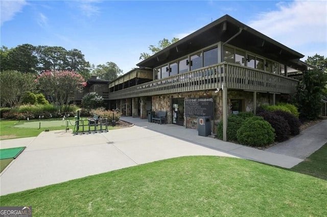 exterior space featuring a patio area and a yard