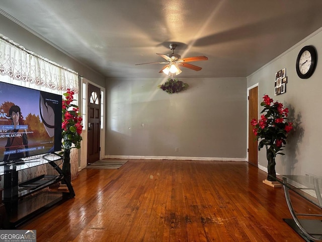 entryway with wood-type flooring and ceiling fan