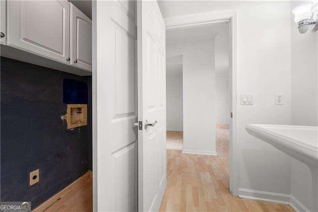 corridor with light wood-type flooring