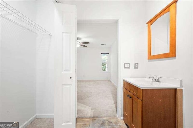 bathroom featuring vanity and ceiling fan