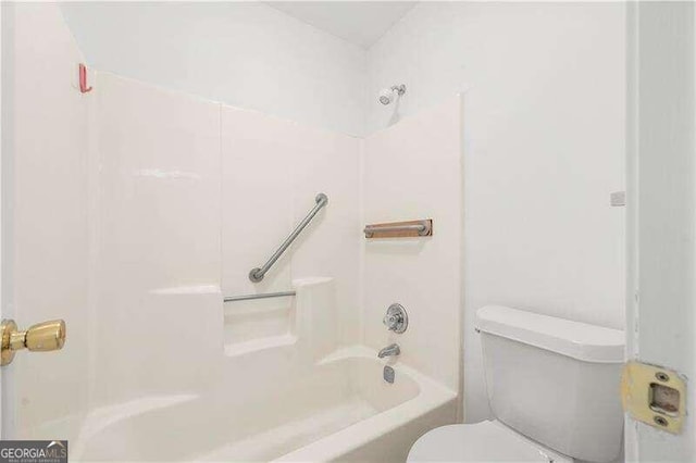 bathroom with toilet and shower / washtub combination