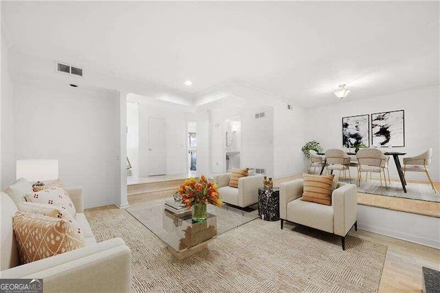 living room with light hardwood / wood-style flooring