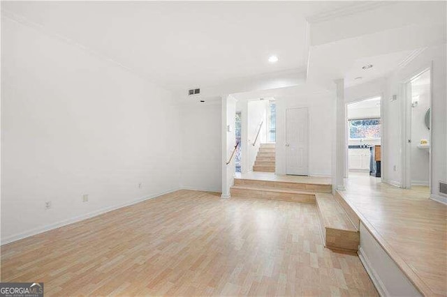 unfurnished living room featuring light hardwood / wood-style flooring