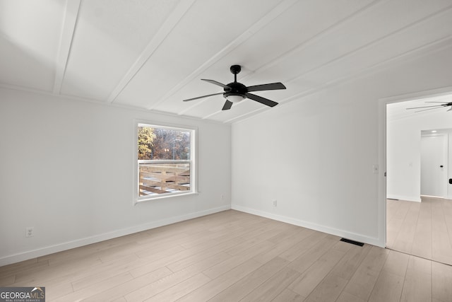 unfurnished room featuring ceiling fan, beamed ceiling, and light hardwood / wood-style floors