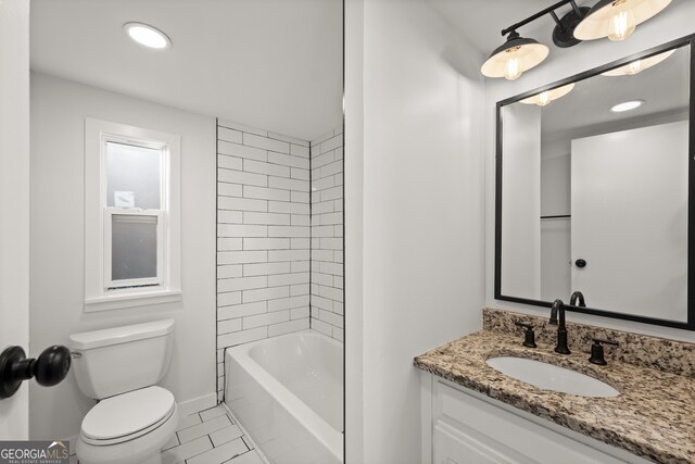 full bathroom with tile patterned flooring, vanity, toilet, and tiled shower / bath combo