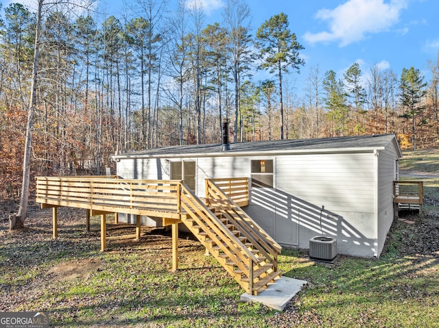 back of property featuring a deck and central air condition unit