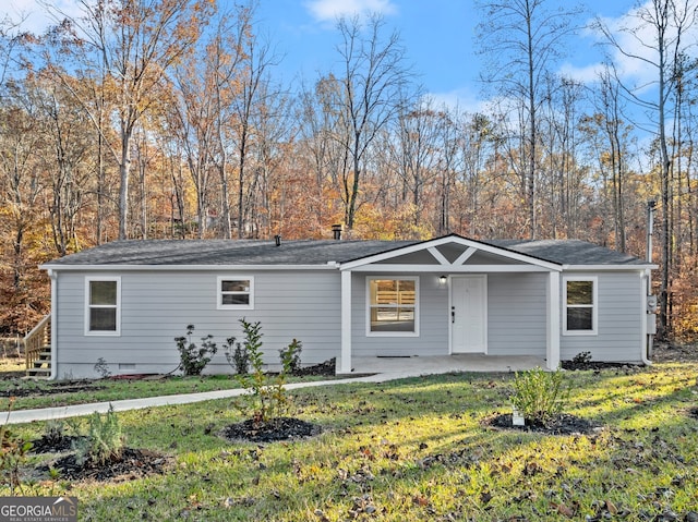 ranch-style house with a front lawn