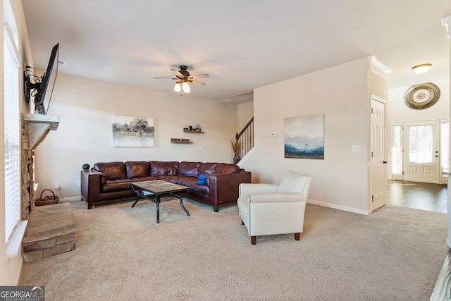 living room with ceiling fan and light hardwood / wood-style floors