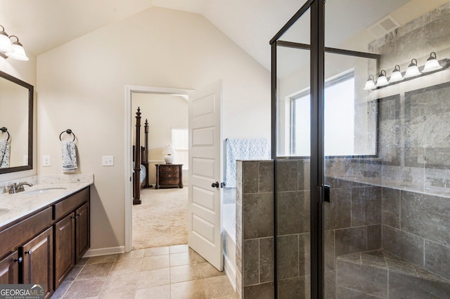 bathroom with tile patterned floors, a shower with shower door, lofted ceiling, and vanity