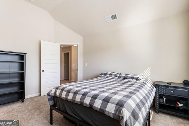 bedroom with light carpet and lofted ceiling