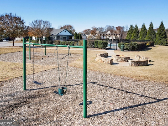 surrounding community featuring an outdoor fire pit