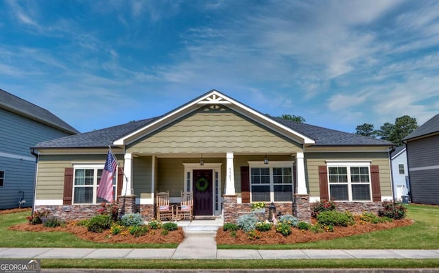 craftsman-style home featuring covered porch