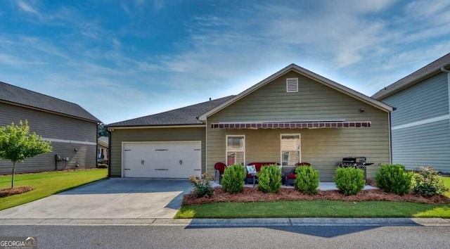 view of front of property featuring covered porch and a garage