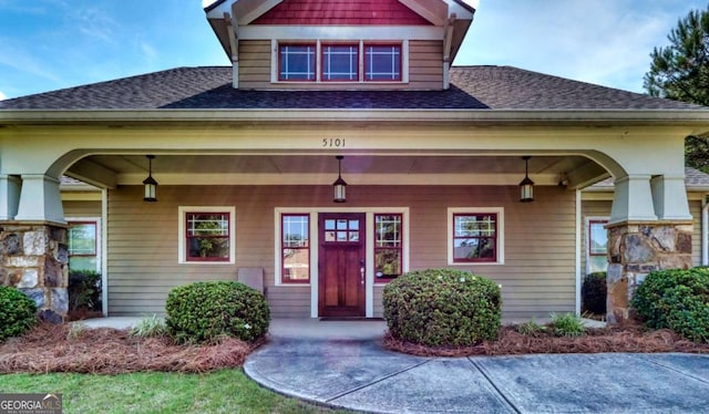 doorway to property featuring a porch