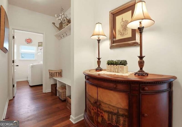 hallway with dark hardwood / wood-style flooring