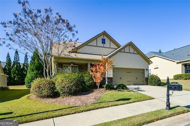 view of front of house featuring a garage and a front lawn