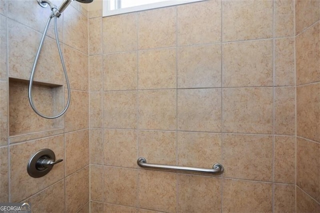 details featuring a tile shower