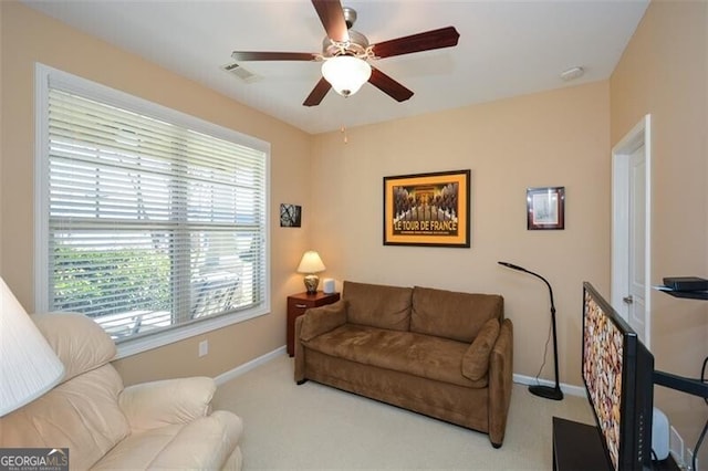 living room with carpet flooring and ceiling fan