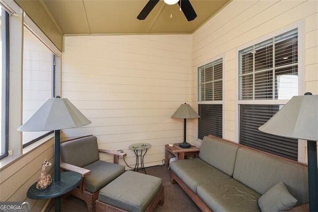 exterior space featuring ceiling fan and lofted ceiling