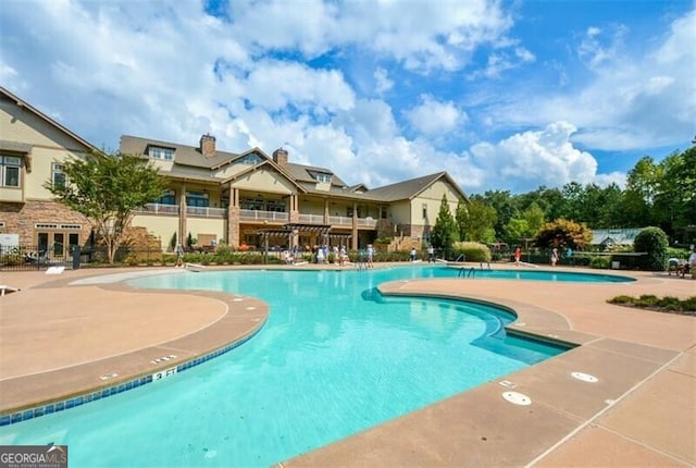 view of pool featuring a patio