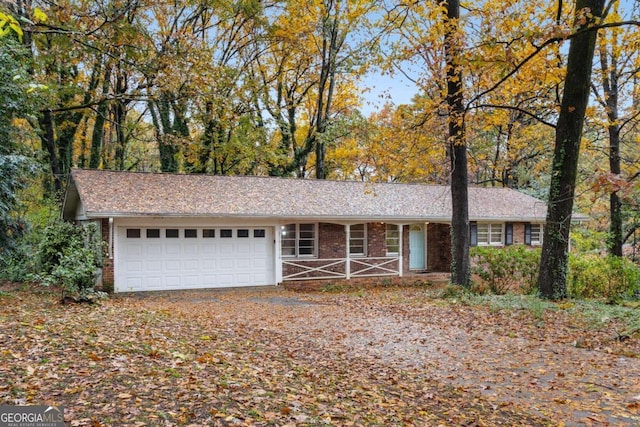 ranch-style house featuring a garage