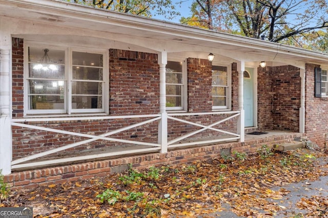 doorway to property with covered porch