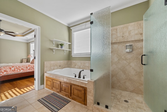 bathroom with hardwood / wood-style floors, ceiling fan, crown molding, and independent shower and bath