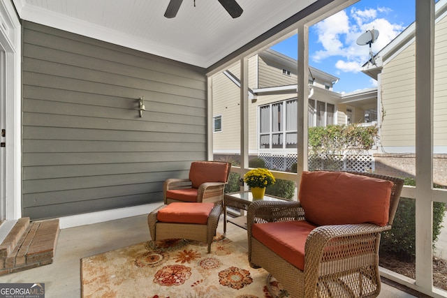 sunroom featuring ceiling fan