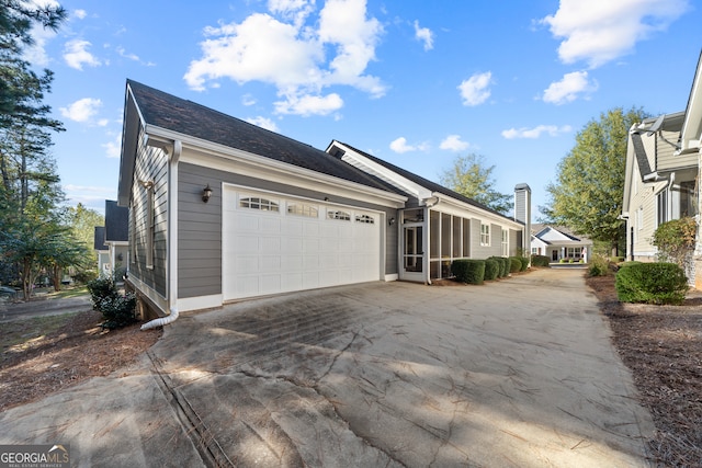 view of property exterior with a garage