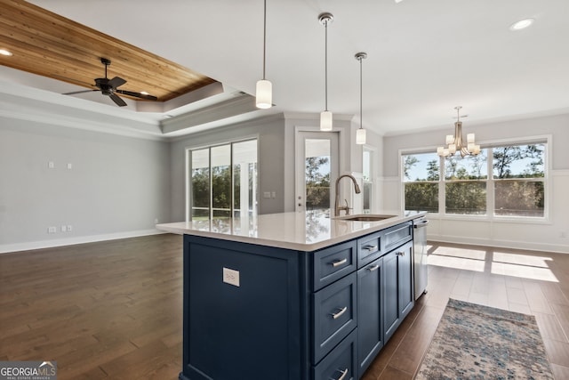 kitchen featuring a center island with sink, dark hardwood / wood-style flooring, sink, and a wealth of natural light